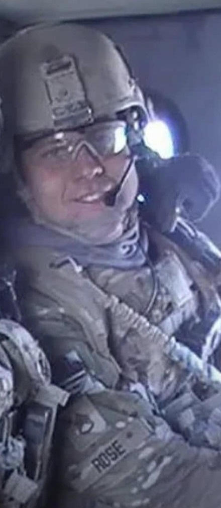 Cody Rose in a helicopter in full kit during a deployment to Afghanistan.
